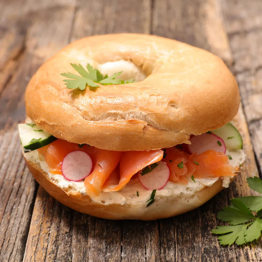 Bagel with cream cheese, smoked salmon, cucumber and radish